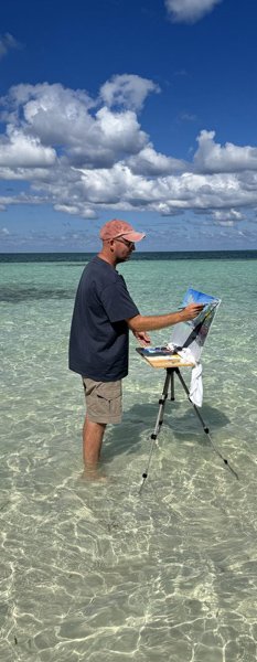 Painting standing in the sea, Bahamas